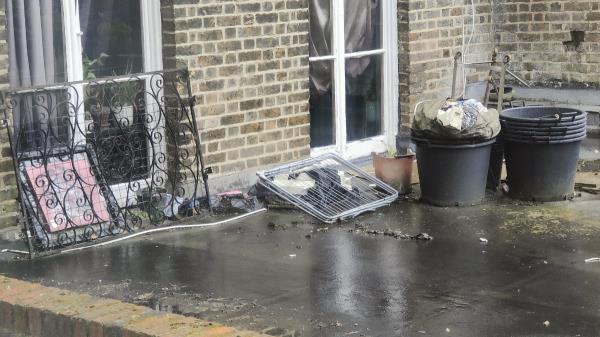 

This is located on a private property. There is eyesore fly-tipping located both in the garden and 1st floor terrace (I'm not sure this is 124B but it's the 124 building). 
Thanks -124B, Devonshire Road, London, SE23 3SZ