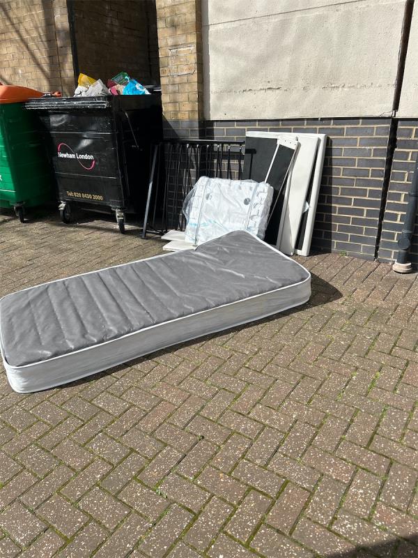 Bed frame and mattress in the street-Chatsworth House, 15 Wesley Avenue, Silvertown, London, E16 1TD
