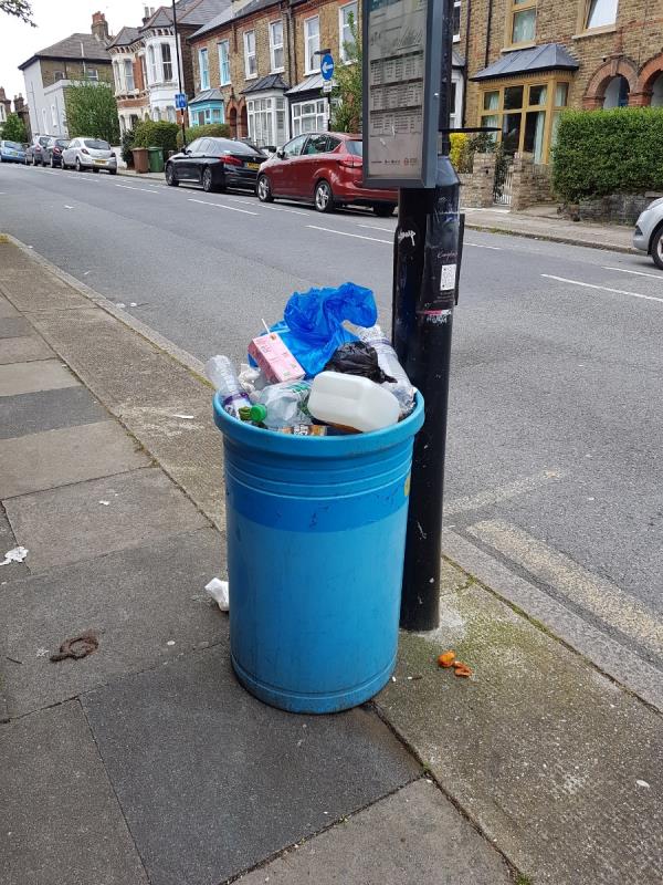 This was reported several times last week. Yesterday the litter around the bin was cleared but bin left full. One day later bin again overflowing and litter around. BIN NEEDS EMPTYING -19 Sprules Road, London, SE4 2NL