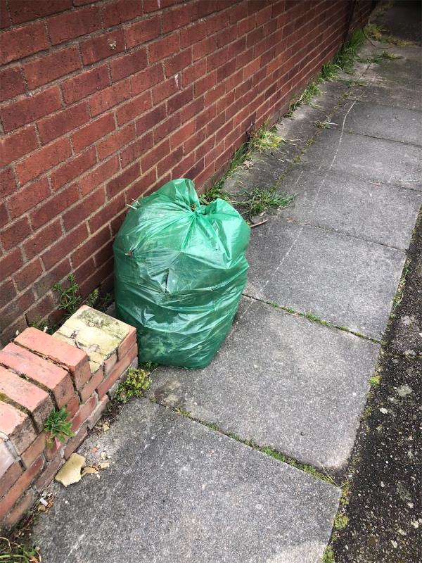 Please clear dumped bag from outside garage area-45 Aldersgrove Avenue, Grove Park, London, SE9 4PH