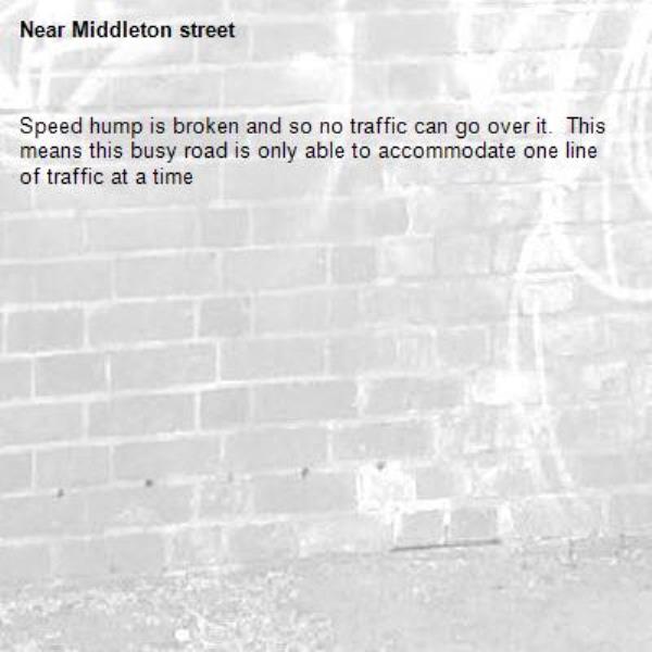 Speed hump is broken and so no traffic can go over it.  This means this busy road is only able to accommodate one line of traffic at a time-Middleton street 