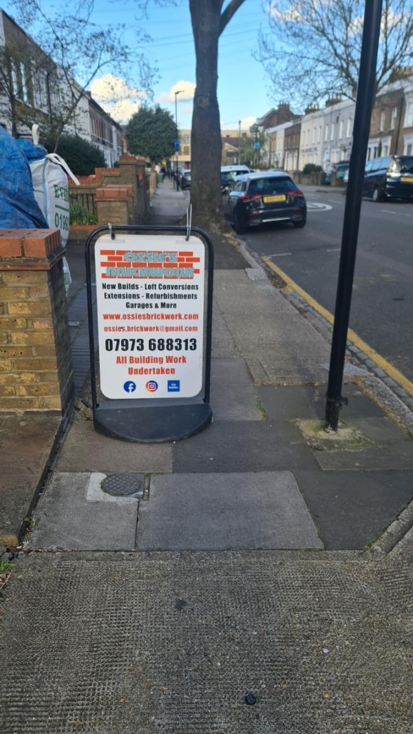 Someone has left a sign in the middle of the pavement -21 Manbey Grove, Stratford, London, E15 1EX