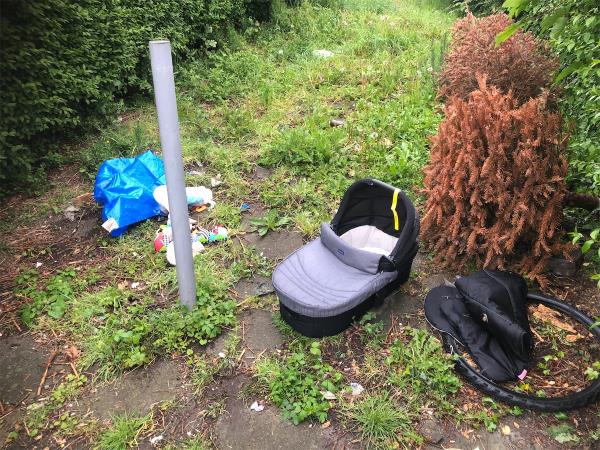 Please clear flytip from grass area at side of property -254 Shroffold Road, Bromley, BR1 5JF