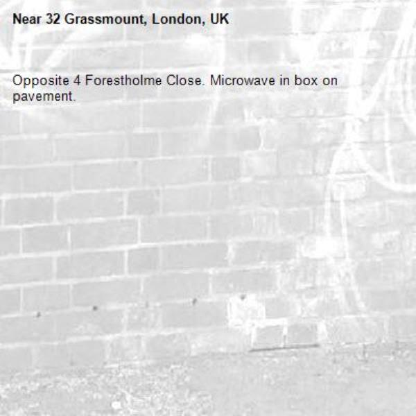 Opposite 4 Forestholme Close. Microwave in box on pavement. -32 Grassmount, London, UK