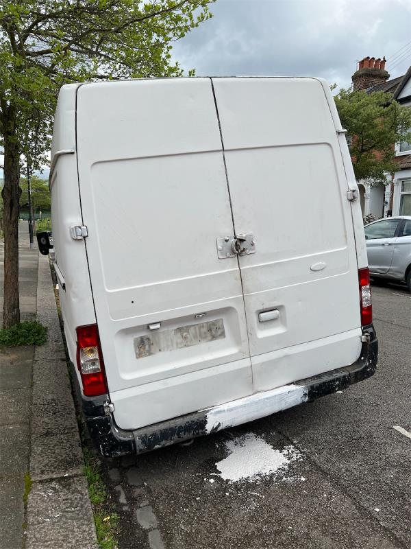 A white van has been abandoned in front of No 9 Roslyn Road, N15 5ES. The registration number has been white-washed out, so it would suggest some illegal usage of the vehicle. The paint has left white emulsion,looking unsightly, on the road surface. 
Please could you remove this vehicle, and also get someone to remove the paint from road? Thanks. -7 Roslyn Road, Tottenham, London, N15 5ES