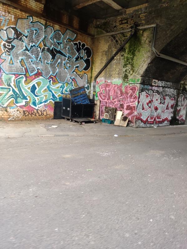 Please remove pallets and wooden boxes urgently before they are dragged into the park for use in illegal encampments, which happens regularly -111 Rolt Street, London, SE8 5JZ