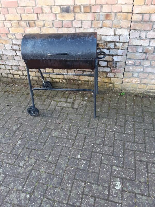 Barbecue burner by wall of No 1 Wintergreen close-3 Yarrow Crescent, Beckton, London, E6 5UH