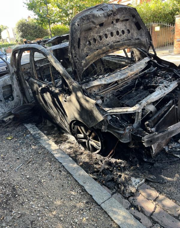 Good afternoon 

It s the second time i send an email .
A car has burned 10 days ago and it s still on the street. Kids come around and touch the véhicule. You should take action asap and remove this car.-N6 4NY 