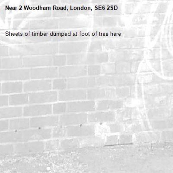 Sheets of timber dumped at foot of tree here-2 Woodham Road, London, SE6 2SD