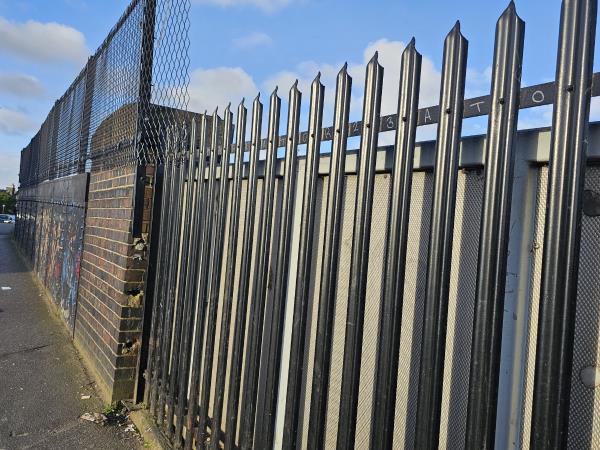 Tagging on black metal railings-Kiosk, Southall Railway Station, South Road, Southall, UB2 4AA