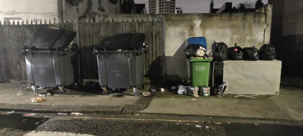 Overflowing large bins have been here for weeks blocking the pavement and now a sofa or fridge has also been left there-6 Morley Road, Stratford, London, E15 3HG