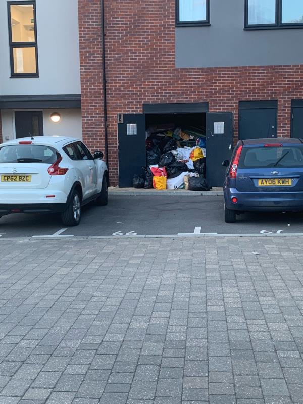 Bins at 7 Presentation Way bin store have not been emptied and rubbish is spilling onto the street. It stinks and is a health and fire hazard for the whole street. The area is becoming infested with rats.-7 Presentation Way, Reading, RG30 3EU