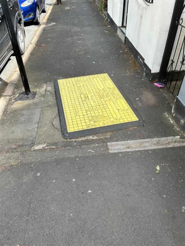 Manhole cover was damaged during maintenance works. There has been a temporary board over it for the last few weeks, is this going to be replaced anytime soon? -18 Hall Road, East Ham, London, E6 2NQ