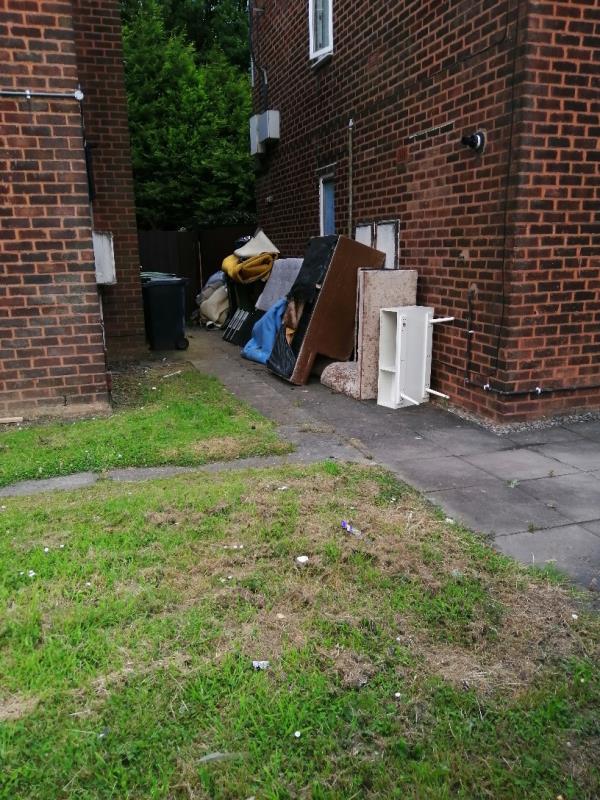 Several household items dumped at the side of 3A Station Road, Bilston. This is attracting drug users looking for scrap metal.-3a Station Road, Bilston, WV14 0NY