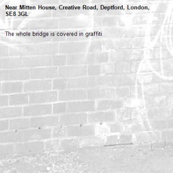 The whole bridge is covered in graffiti -Mitten House, Creative Road, Deptford, London, SE8 3GL
