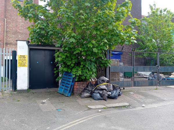 Black bags full of buildings waste -23 Morena Street, London, SE6 4JA