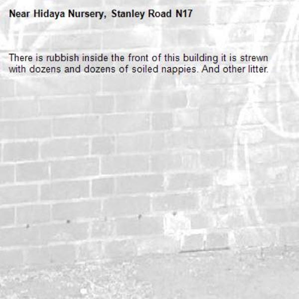 There is rubbish inside the front of this building it is strewn with dozens and dozens of soiled nappies. And other litter.-Hidaya Nursery, Stanley Road N17