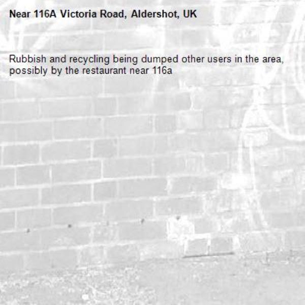 Rubbish and recycling being dumped other users in the area, possibly by the restaurant near 116a -116A Victoria Road, Aldershot, UK