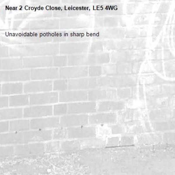 Unavoidable potholes in sharp bend -2 Croyde Close, Leicester, LE5 4WG