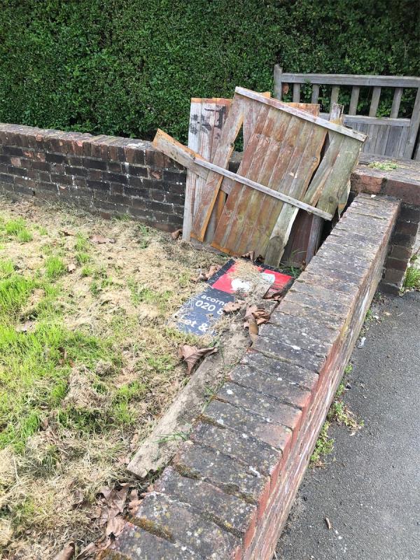 Outside no 325. Please clear fencing and an estate agents board from grass area-325 Downham Way, Downham, BR1 5EN, England, United Kingdom