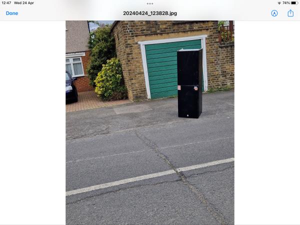 Fridge freezer has been dumped overnight on the pavement, close to the road. It is also blocking a garage entrance.-213 Conisborough Crescent, London, SE6 2SE