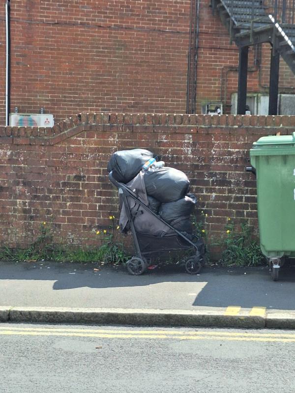Pushchair, 4 black bags of stuff. 
On wall side by coop shop.
Junction of Milton Rd and Victoria Drive.-141 Milton Road, Eastbourne, BN21 1SS