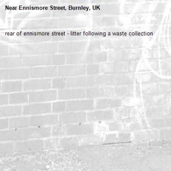 rear of ennismore street - litter following a waste collection-Ennismore Street, Burnley, UK