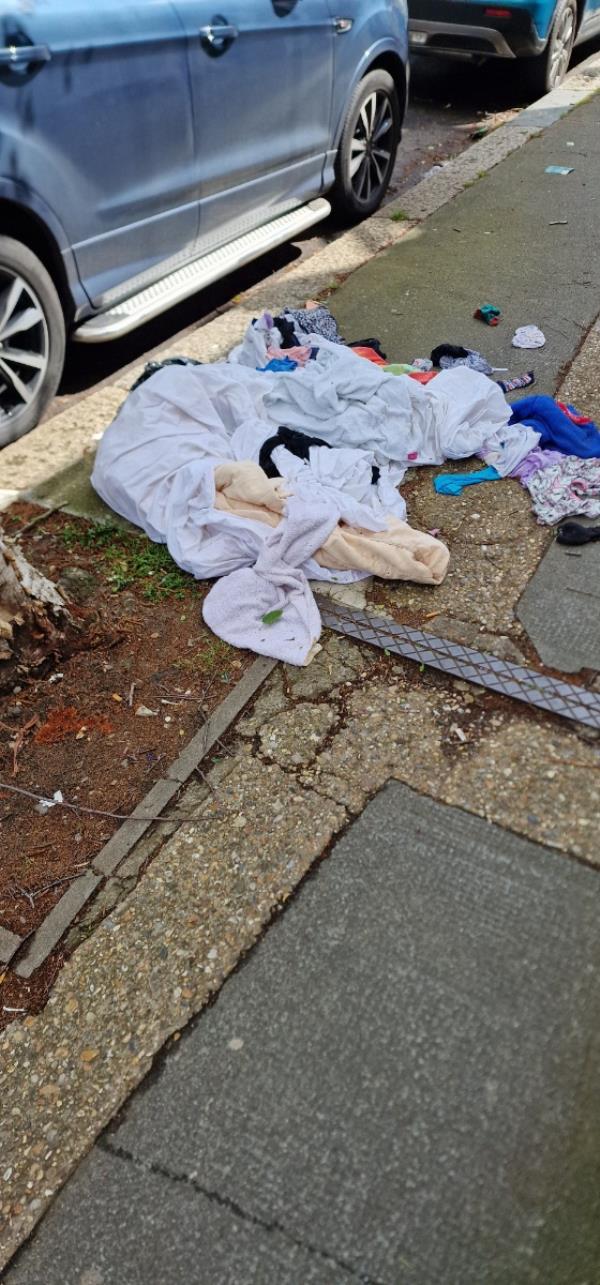 Loads of clothing dumped outside 4 Seventh avenue E12 5JQ -4 Seventh Avenue, Manor Park, London, E12 5JQ