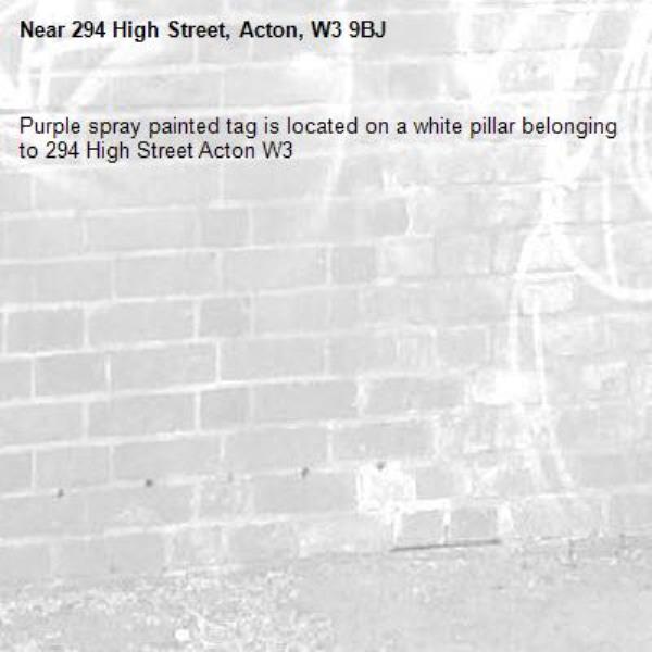 Purple spray painted tag is located on a white pillar belonging to 294 High Street Acton W3 -294 High Street, Acton, W3 9BJ