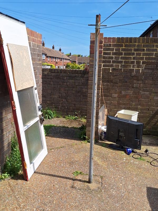 Door, TV assorted house hold waste dumped in the drying area -Buckingham Court, Rockhurst Drive, Eastbourne, BN20 8UW