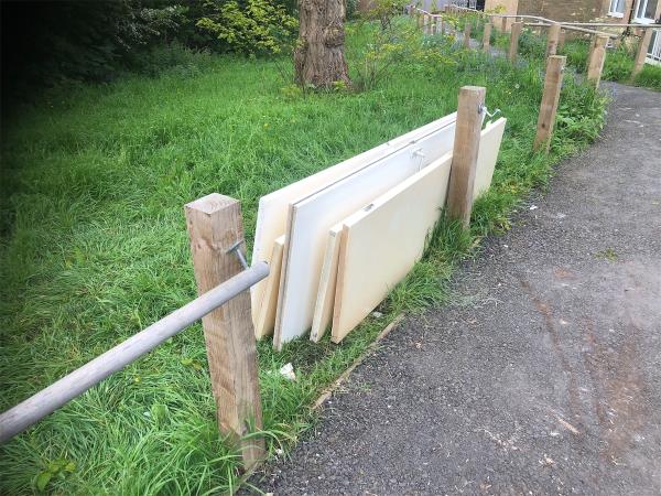 Please arrange for removal of  dumped wood from start of temporary path-Millcroft House, Melfield Gardens, London, SE6 3AJ