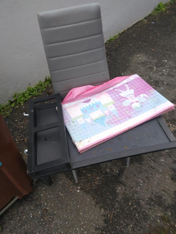 Chair and board fly tipped in  gap between 25&27 Belmore Road BN22 8BN-25 Belmore Road, Eastbourne, BN22 8BN