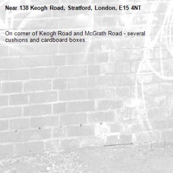 On corner of Keogh Road and McGrath Road - several cushions and cardboard boxes.-138 Keogh Road, Stratford, London, E15 4NT