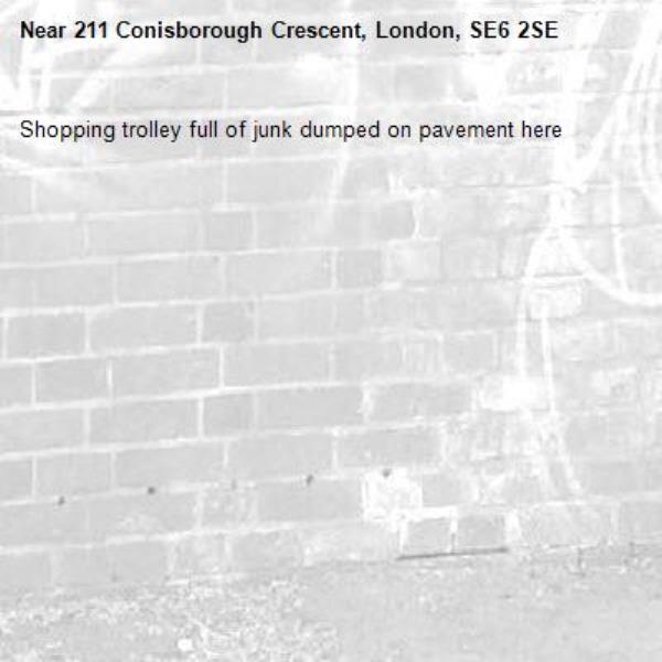 Shopping trolley full of junk dumped on pavement here -211 Conisborough Crescent, London, SE6 2SE