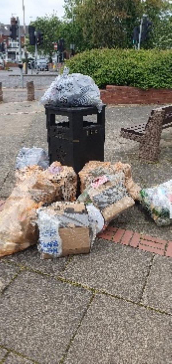 Contaminated orange bags flytipped nxt to bin. Hinckley Rd junction, bench area. Illegal flytip.-197 Hinckley Road, Leicester, LE3 0TF