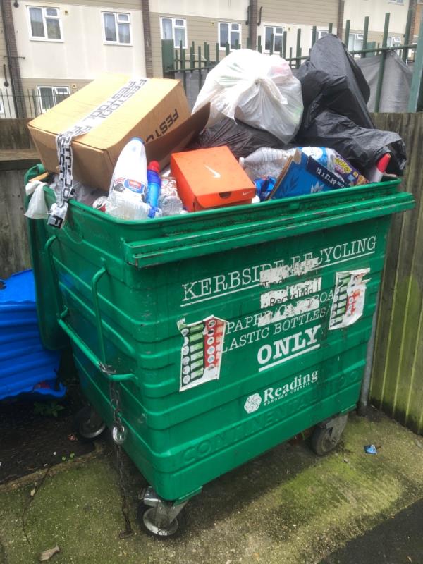 Communal recycling bin contaminated with plastic sacks and overflowing -52 Bamburgh Close, Reading, RG2 7UD