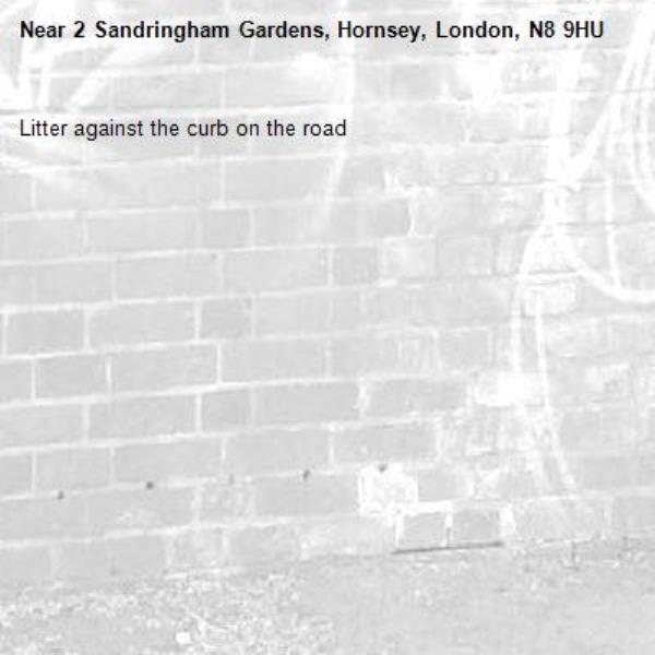 Litter against the curb on the road -2 Sandringham Gardens, Hornsey, London, N8 9HU