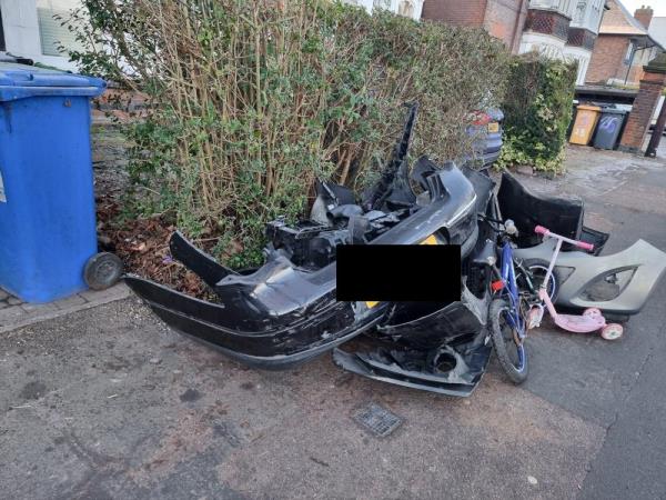 Car and bicycle items dumped on the footpath-26 Victoria Park Road, Castle, LE2 1XB, England, United Kingdom