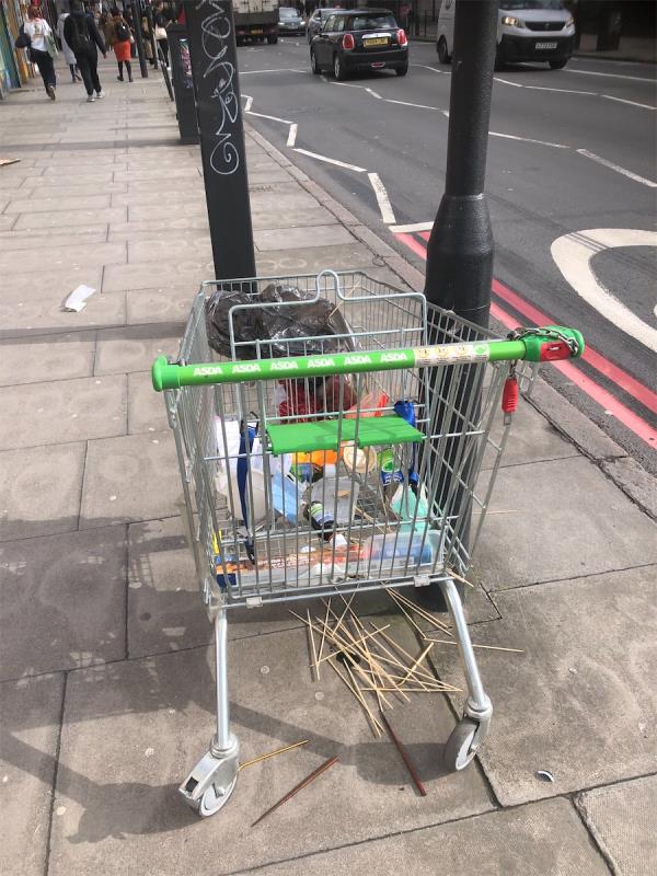 Please clear a no Asda trolley from outside Iceland -277A, New Cross Road, London, SE14 6AS