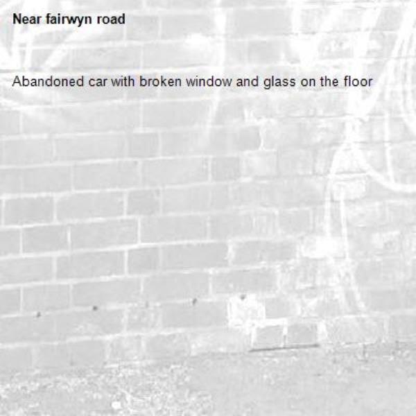 Abandoned car with broken window and glass on the floor-fairwyn road
