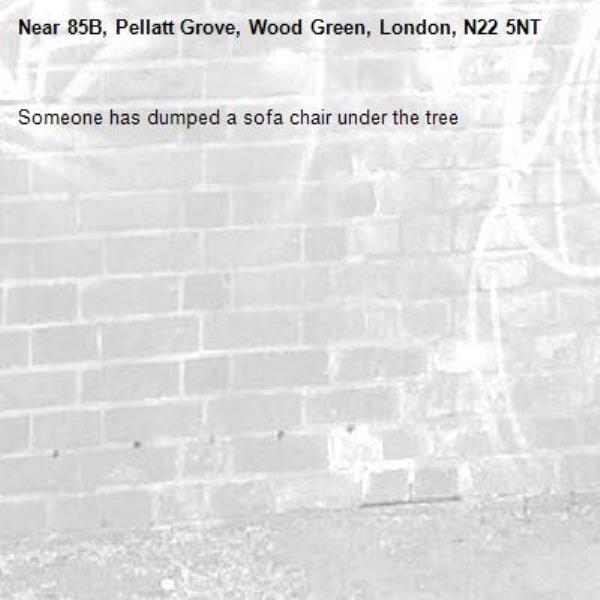 Someone has dumped a sofa chair under the tree -85B, Pellatt Grove, Wood Green, London, N22 5NT