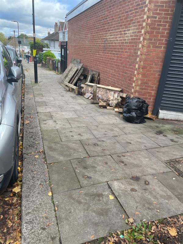 Wood fencing is dumped on the pavement on Clifton Road junction Greenford Road ub6-478 Greenford Road, Greenford, UB6 8SQ