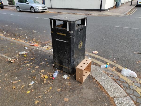 Litter left around bin in front of West Ham Park Margery Gate-171a Ham Park Road, London, E7 9LE