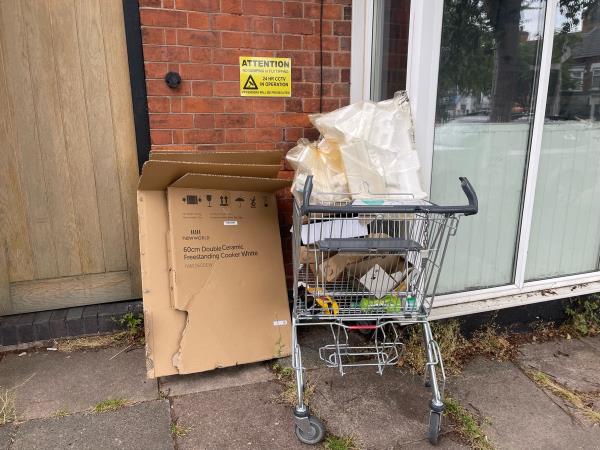 Dumped boxes and trolly-117b Harrow Road, Leicester, LE3 0JZ