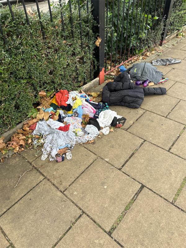 Clothes dumped in pavement-Lloyd Court, Slagrove Place, Ladywell, London, SE13 7LP