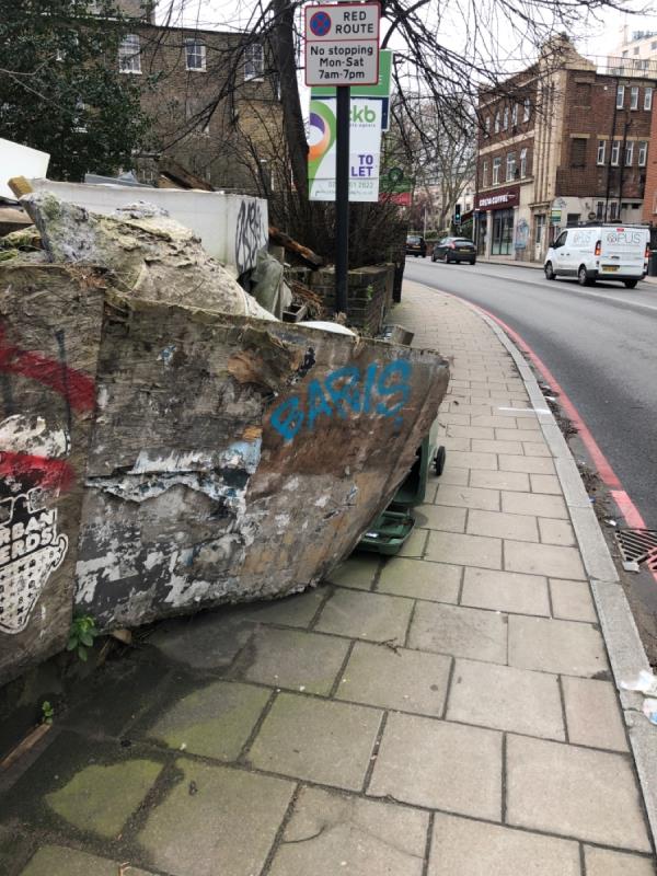 Overflowing rubbish has broken fence and spilling into footpath. Going mouldy and smelly. (Opposite number 16)-16 Parkfield Road, London, SE14 6QB