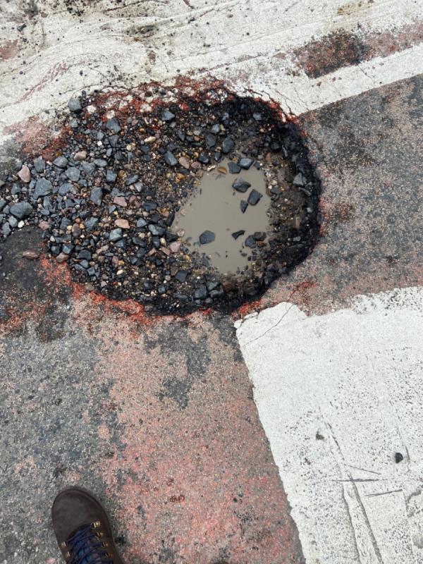Pothole at junction -Flat 1, 43 Russell Street, Reading, RG1 7XG
