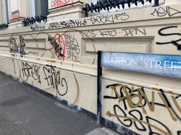 Graffiti spreading all over this wall-Kings Court, 1 Harton Street, London, SE8 4DD