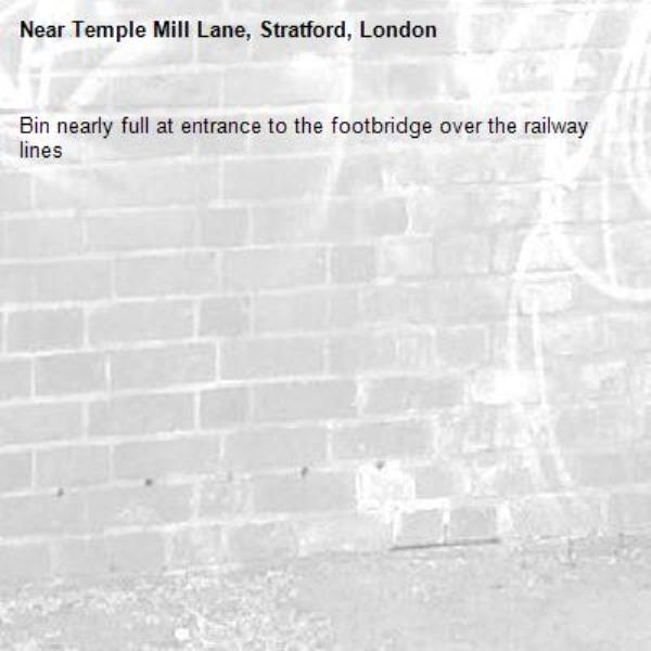 Bin nearly full at entrance to the footbridge over the railway lines -Temple Mill Lane, Stratford, London