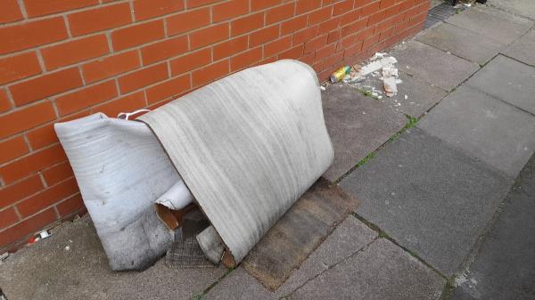 Notorious space on the entrance of Leire Steeet, off Melton Road, is struck yet again! A previous piece of illegal dump was removed after reporting it, and now we are faced with the consequences of another! Dumped upholstery pieces in poor condition. It is causing obstrucion on pavement for passer hys and residents, and restricting cars from parking properly due to on-kerb parking  Litter is also accumalating rapidly around dumped piece, and it is encouraging spitting on there too. -2 Leire Street, Leicester, LE4 6NT